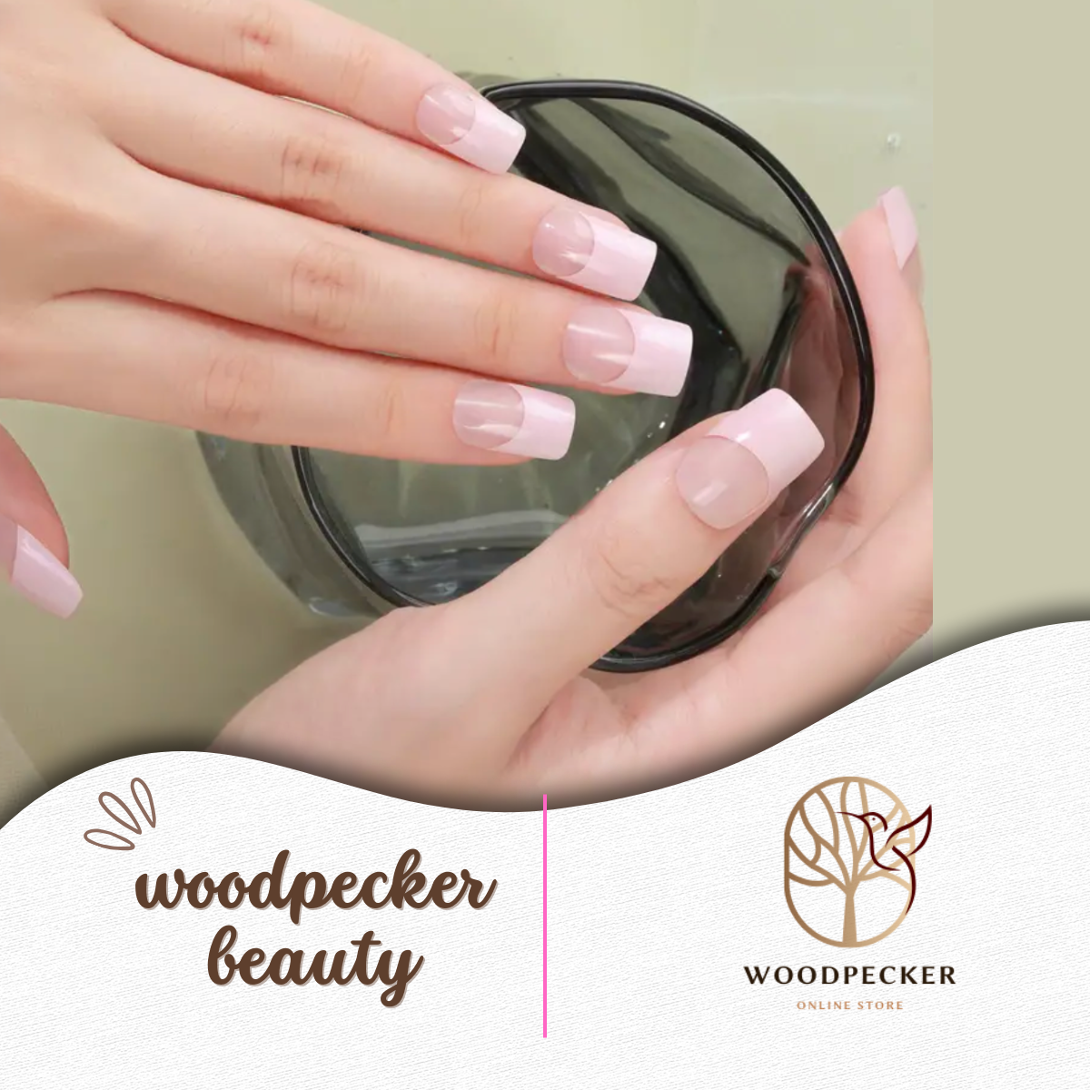 Hands holding a glass, showcasing freshly applied pink French tip nail wraps