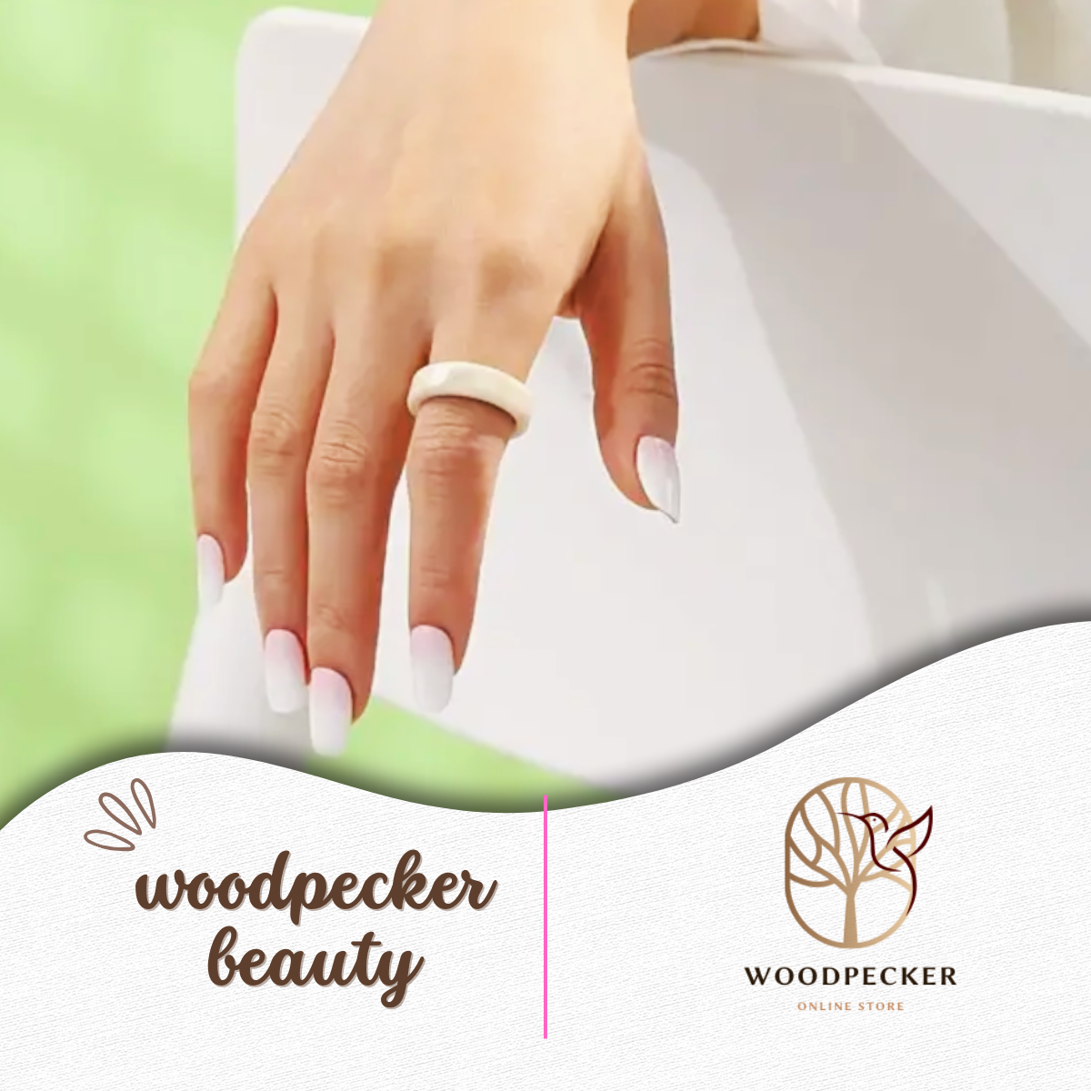 Hand wearing ring and white ombre gel nails, resting on chair – Woodpecker Beauty
