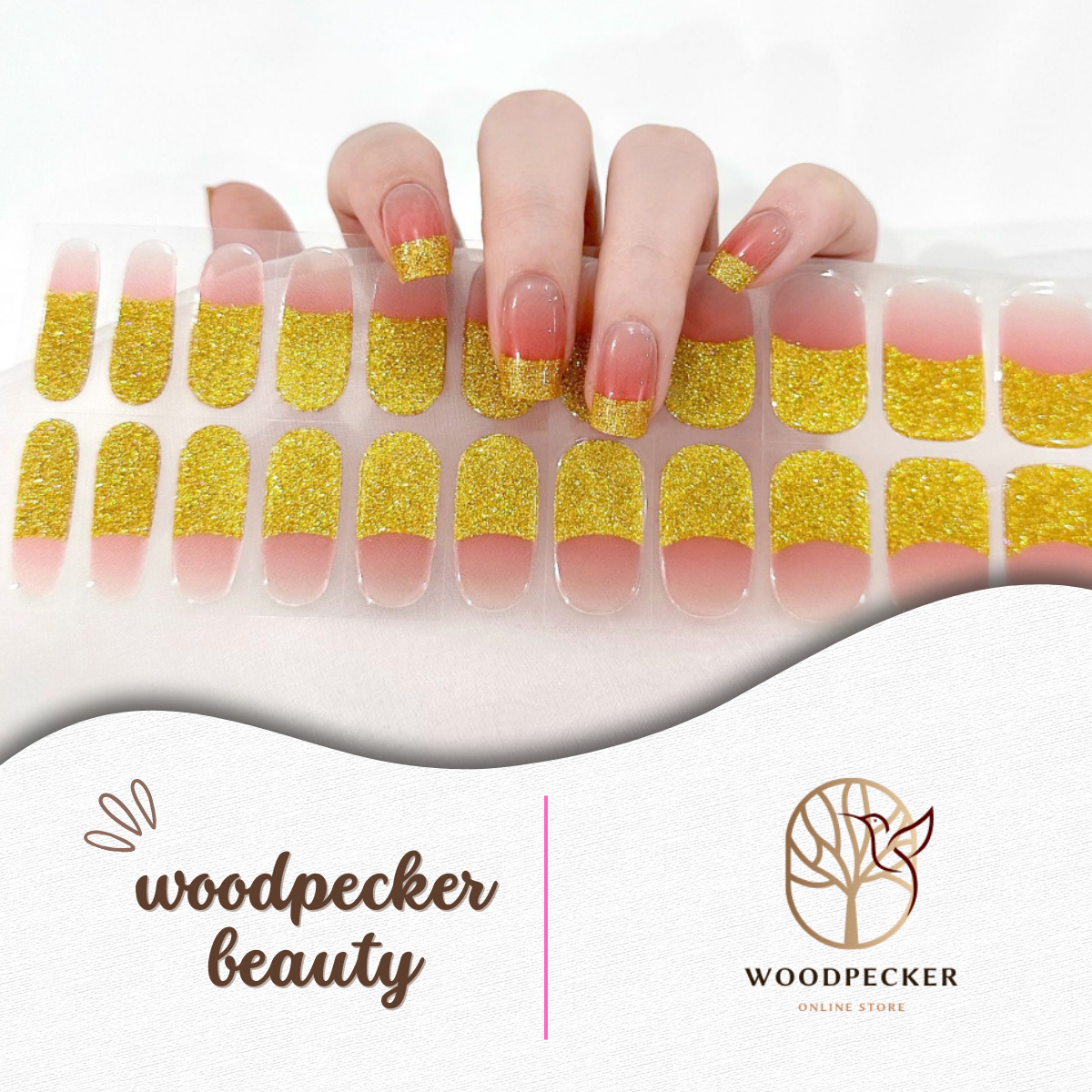 Hand holding full set of gold glitter and nude nail stickers – Woodpecker Beauty