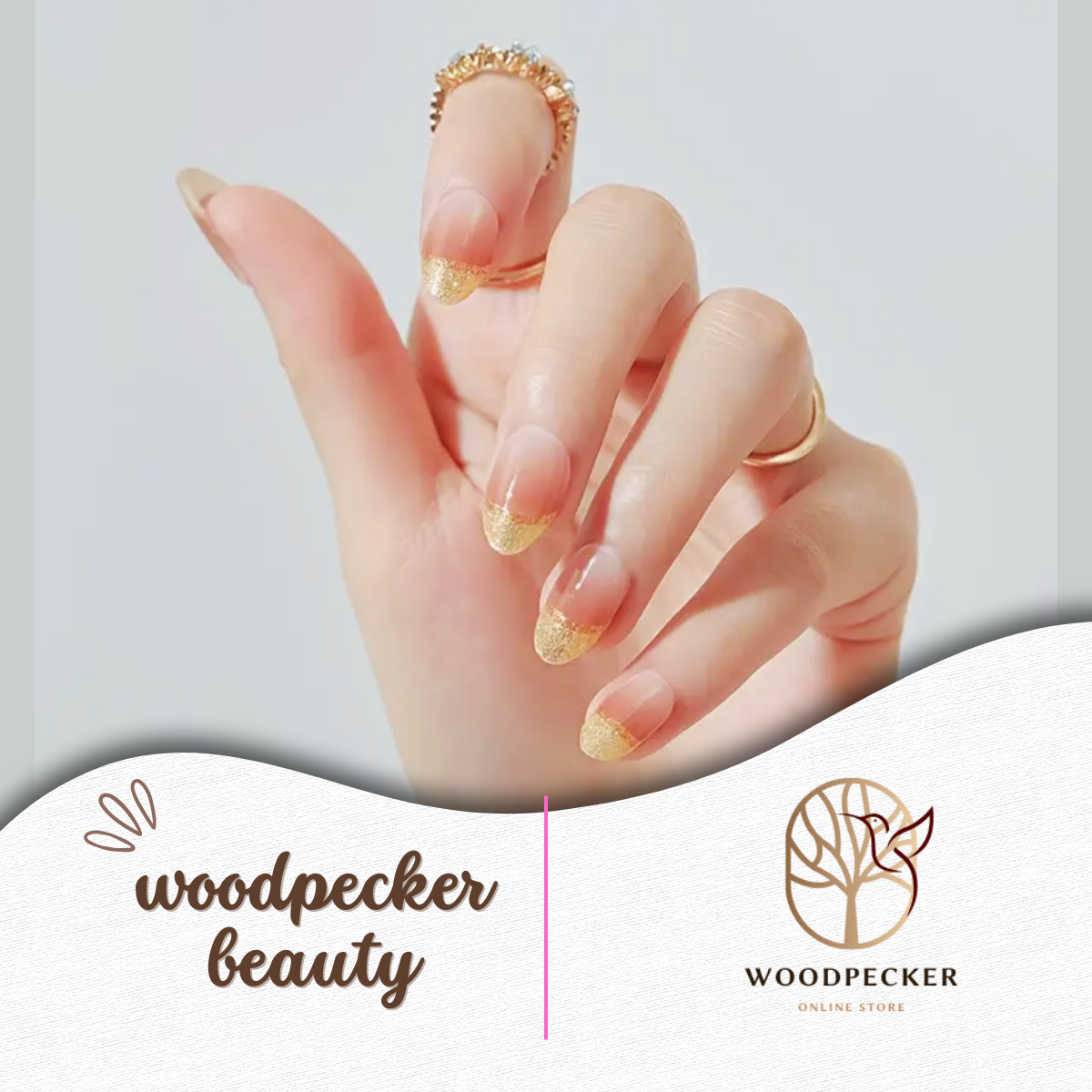 Hand with glossy nude gel nail wraps with golden accents – Woodpecker Beauty