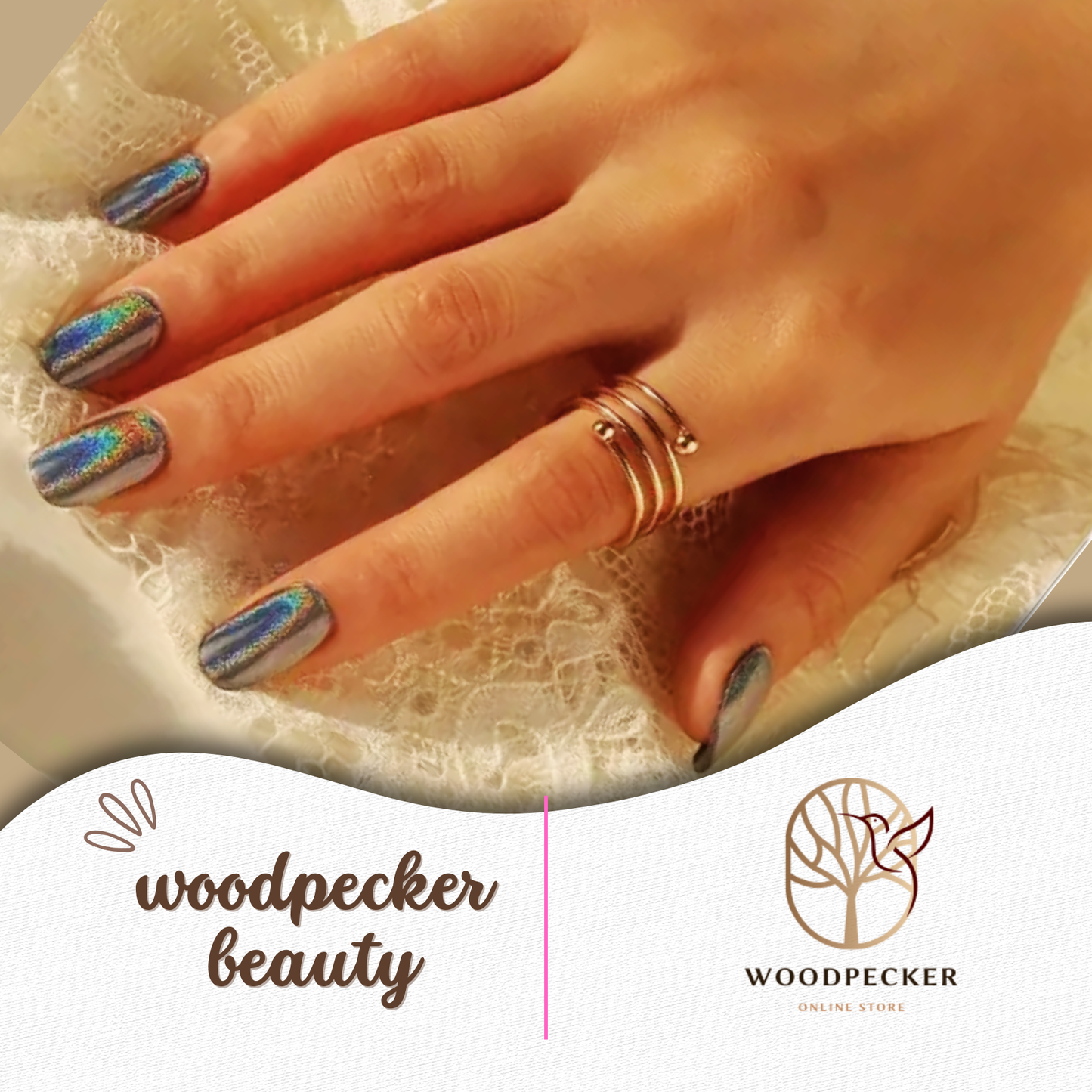 Hand with peacock-inspired aurora nail stickers featuring blue, green, and gold shimmer – Woodpecker Beauty