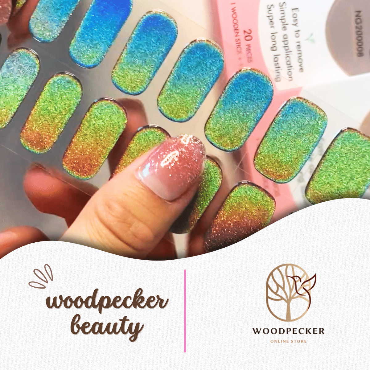 Hand showing applied peacock aurora nail wraps next to full sticker sheet – Woodpecker Beauty