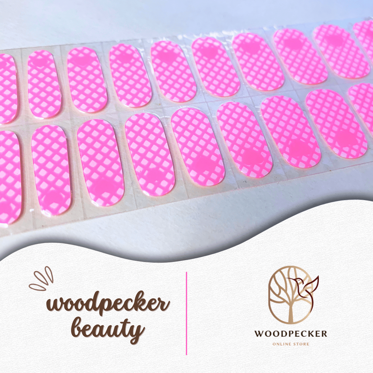 Full sheet of pink heart-themed grid nail wraps with vivid color and neat cutouts