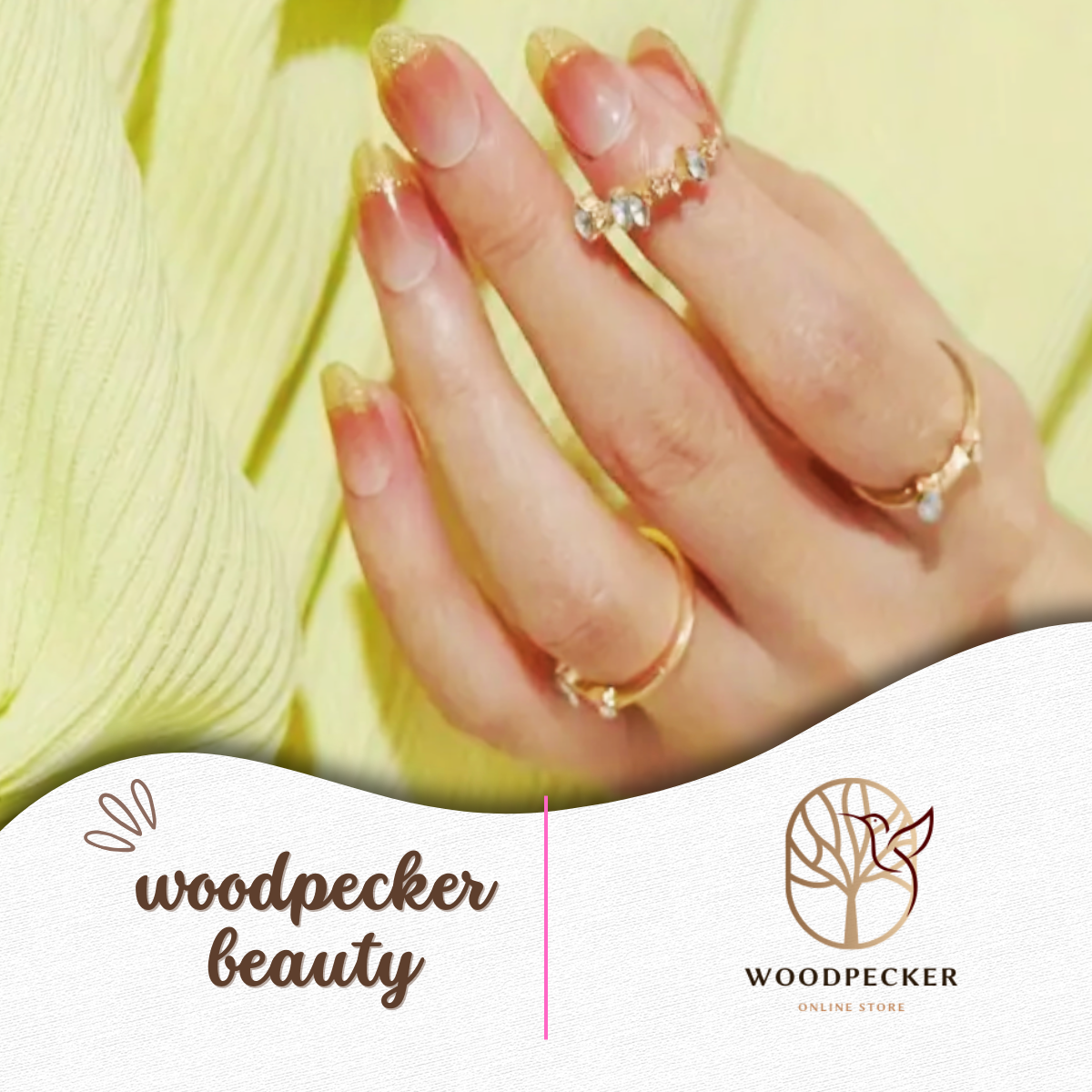 Nude gel nail wraps with fine gold glitter on hand wearing rings – Woodpecker Beauty