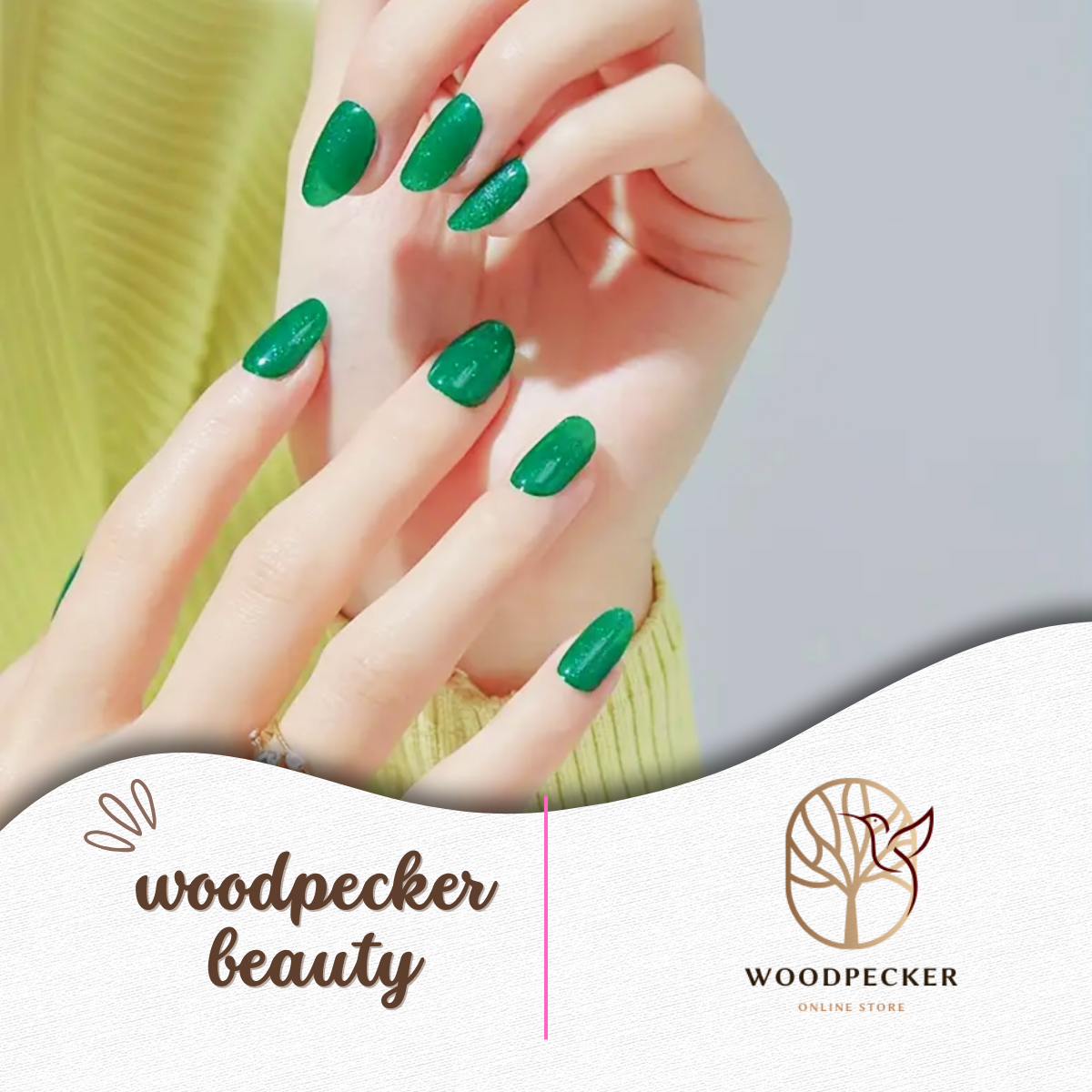 Hands with glossy emerald green nail stickers under soft daylight.