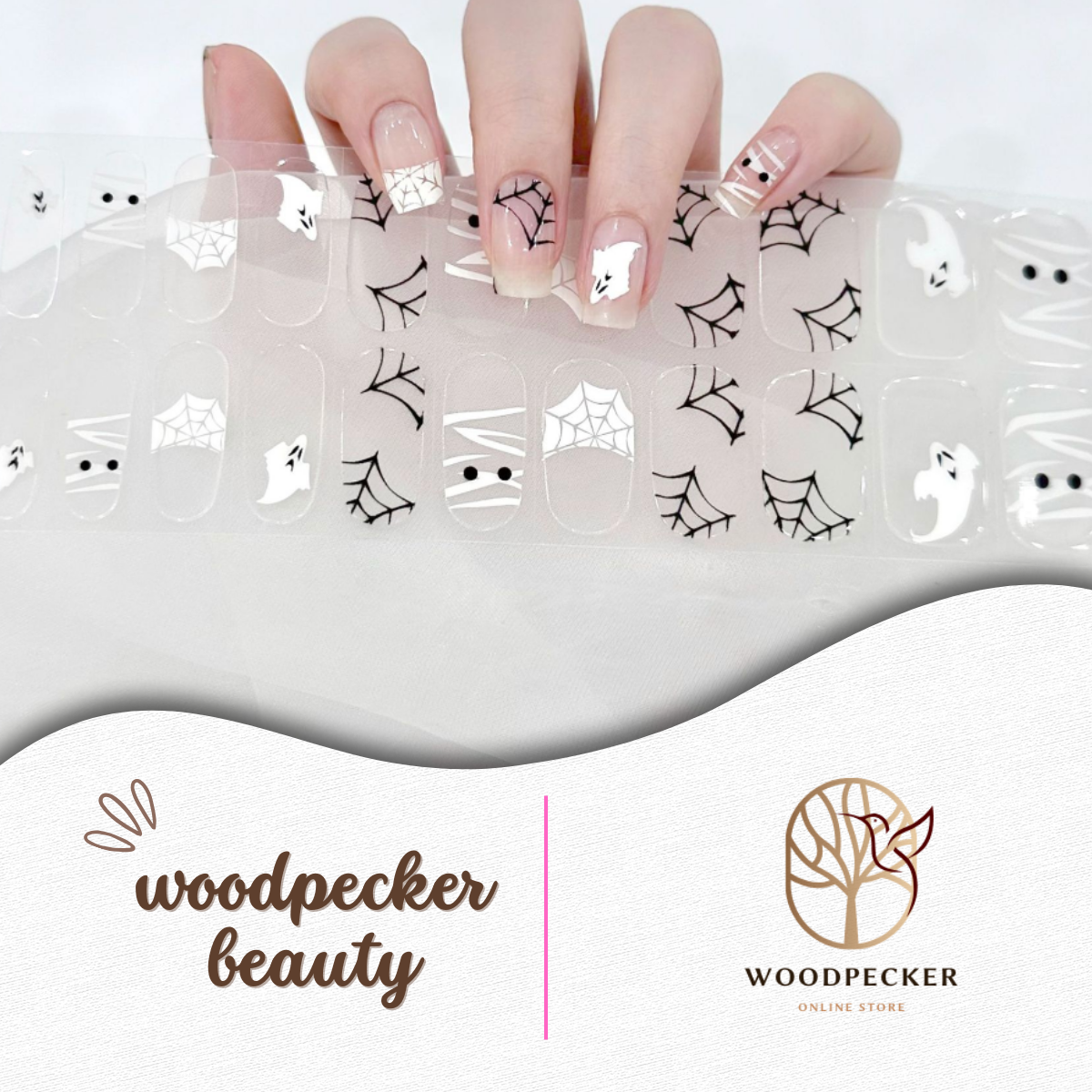 Cute ghost and spiderweb Halloween nail wraps on a clear base