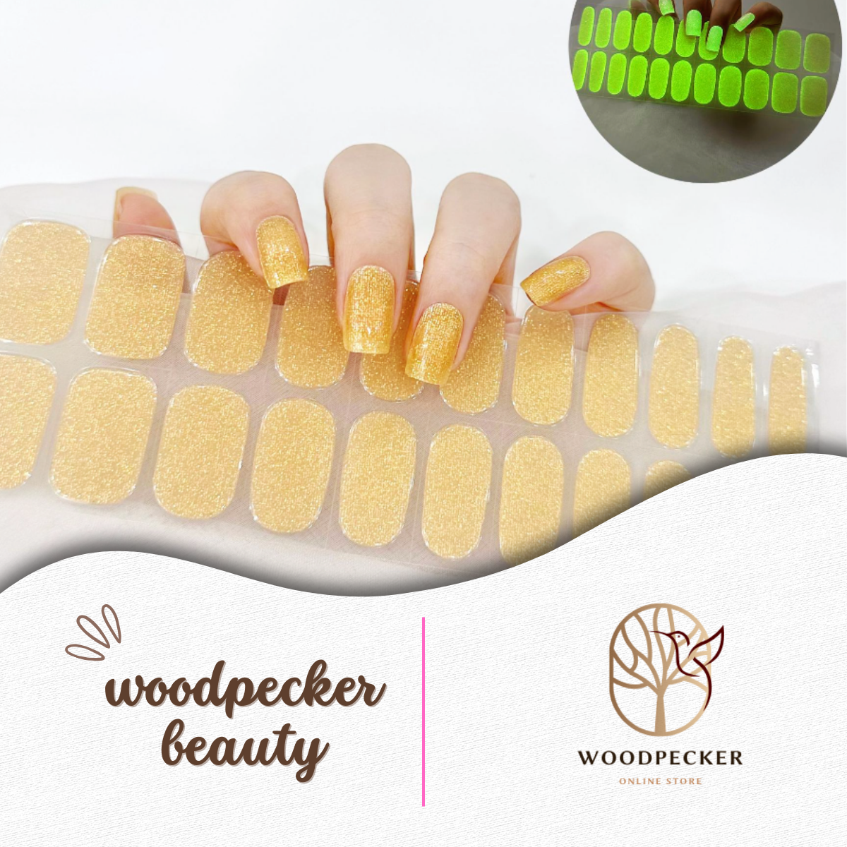 Hand wearing yellow glitter nail stickers that glow green in the dark