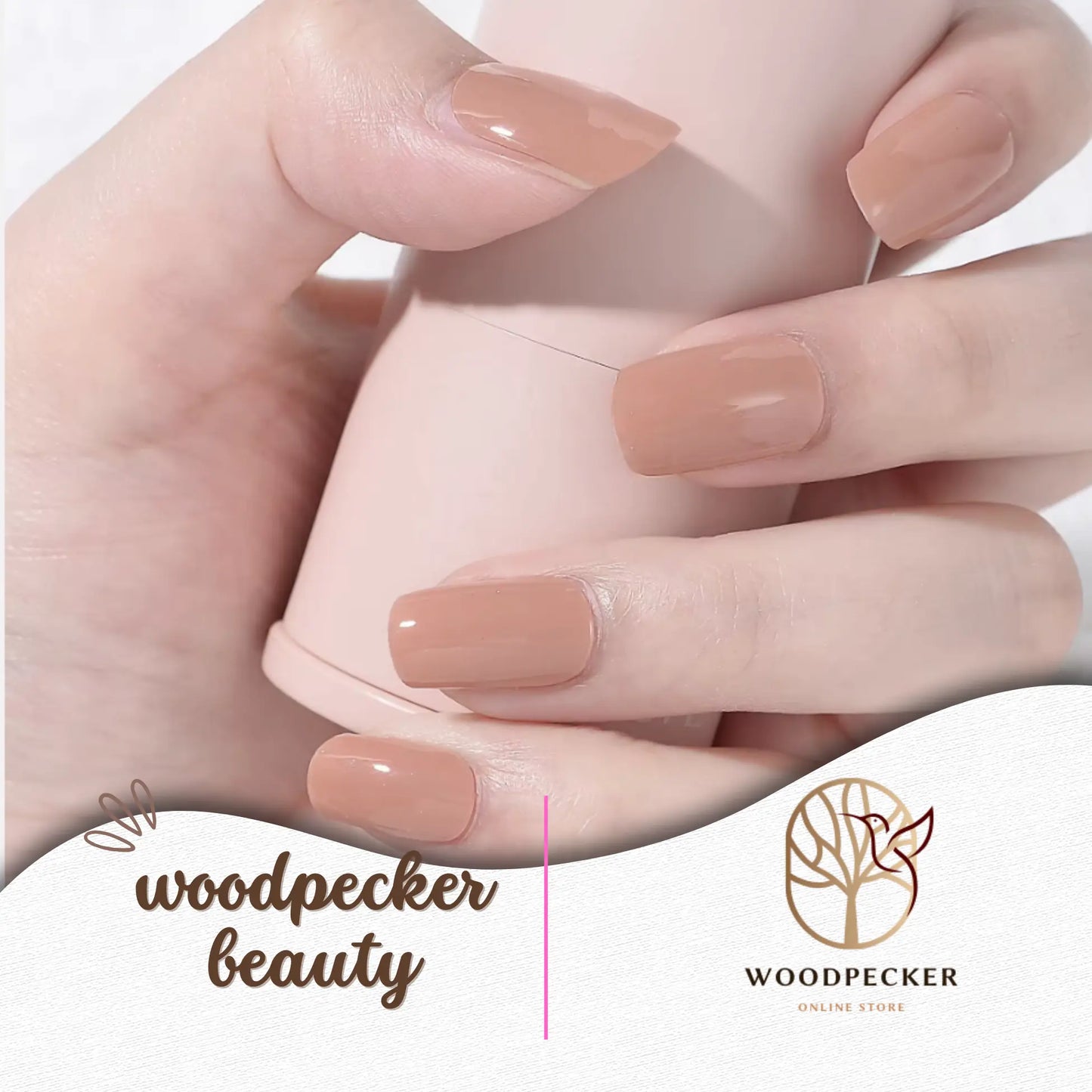 Hand wearing milk tea nude nail stickers in a warm beige-brown shade with a glossy finish.