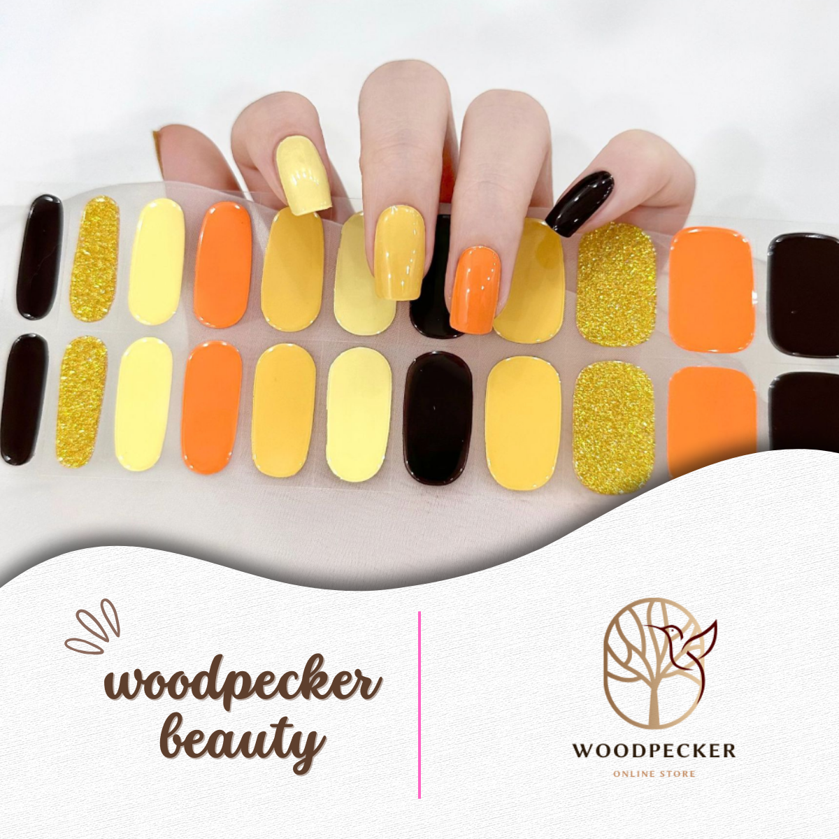 Autumn-inspired semi-cured gel nail wraps in pumpkin orange, mustard yellow, chocolate brown, and golden glitter shades