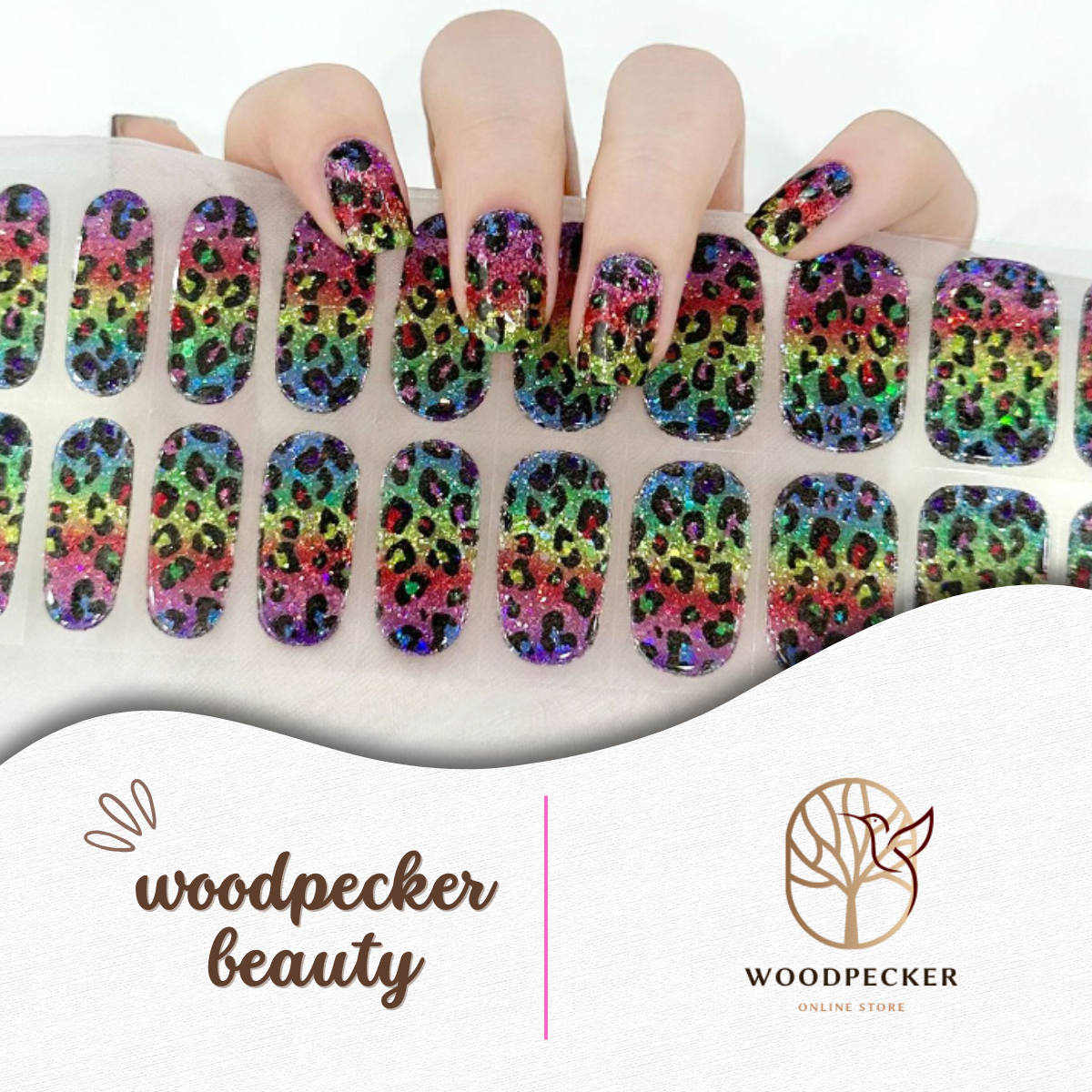 Hand with rainbow glitter leopard print nail stickers from Woodpecker Beauty