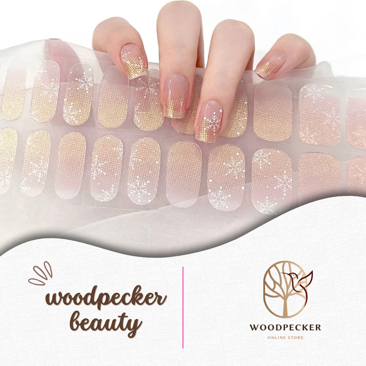 Champagne ombré glitter nail wraps with delicate white snowflake designs, perfect for winter or holiday looks