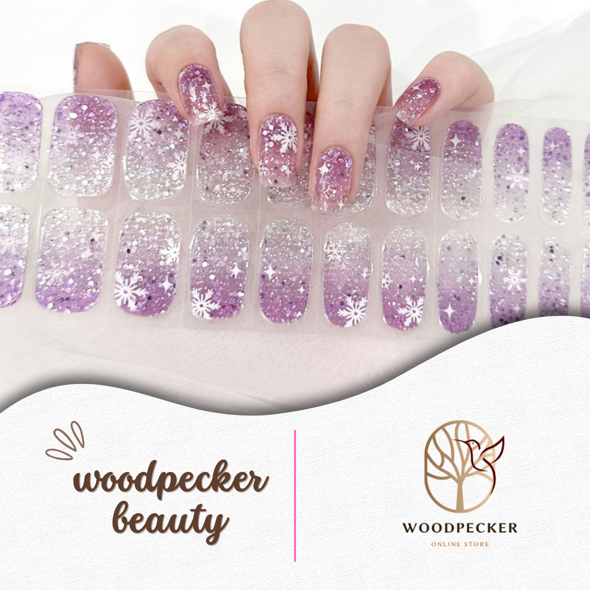 Semi-cured gel nail wraps in purple gradient with silver glitter and snowflake designs, UV lamp required