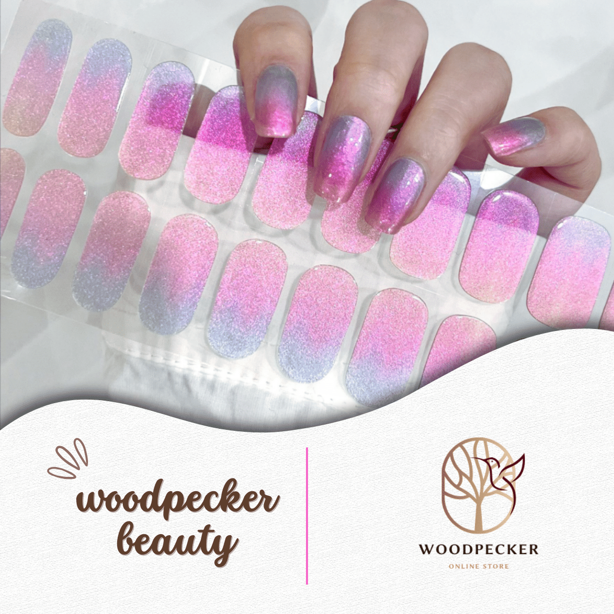 Gradient nail stickers in pink, purple, and blue with subtle shimmer and a soft ombre effect.