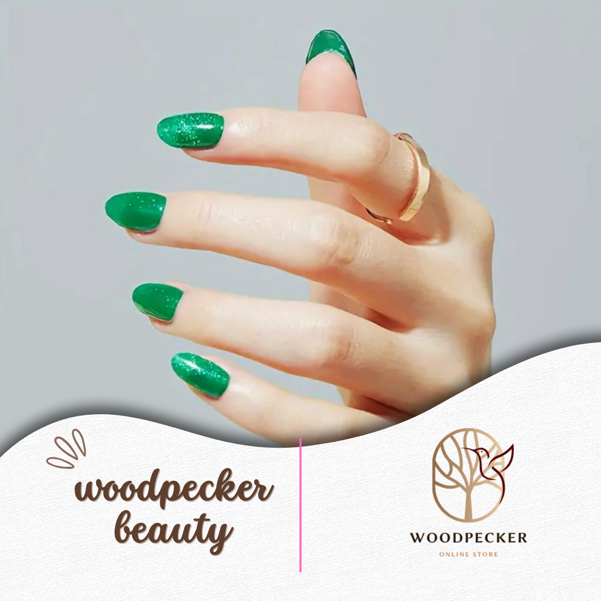 Green nail stickers paired with gold rings, highlighting a modern chic look.