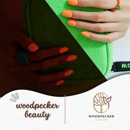Bold orange gel nail wraps shown against a green bag background – Woodpecker Beauty