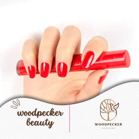 Hand with glossy red gel nail stickers holding a red lipstick – Woodpecker Beauty
