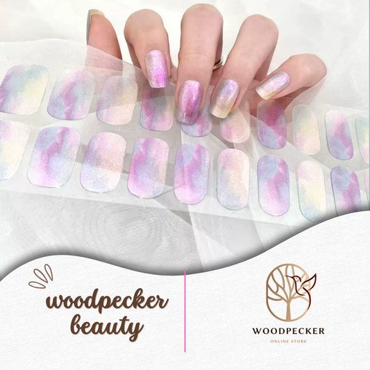 Pastel watercolor nail stickers with a soft blend of pink, purple, blue, and yellow shimmer from Woodpecker Beauty
