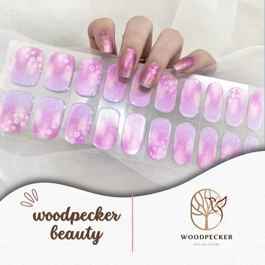 Shimmery pink and lavender gradient nail stickers with soft floral accents from Woodpecker Beauty
