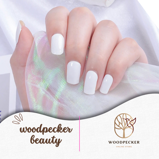 Glossy white gel nail stickers on hand – minimalist manicure look