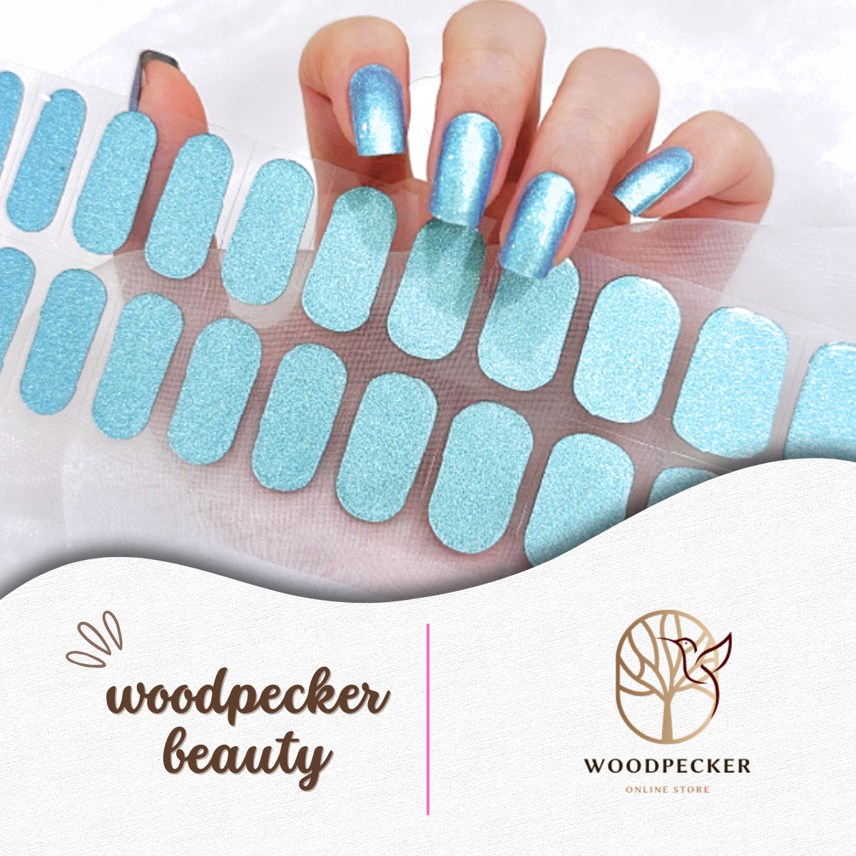 Shimmering ice blue nail wraps with a glossy finish, applied on long square-shaped nails