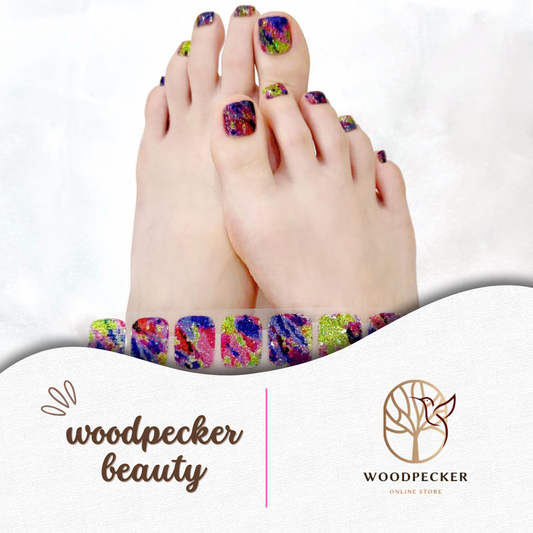 neon multicolor gel toe nail stickers with glitter and splash design applied on toes

