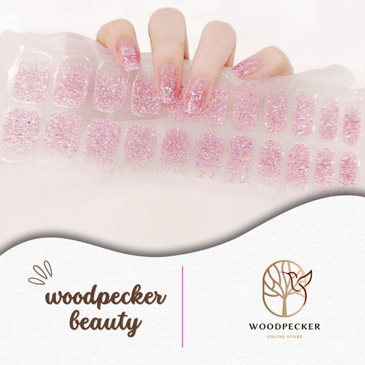 Pink semi-cured gel nail stickers with full glitter finish from Woodpecker Beauty
