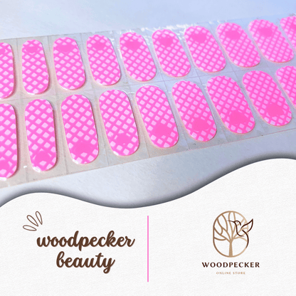Full sheet of pink heart-themed grid nail wraps with vivid color and neat cutouts