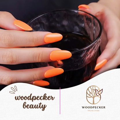 Woman holding wine glass with orange glossy gel nails – Woodpecker Beauty