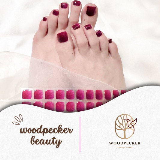 wine red gel toe nail stickers with glossy finish on toes
