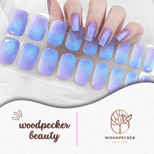 Purple and blue gradient nail stickers with pearlescent shimmer and a soft aurora glow.
