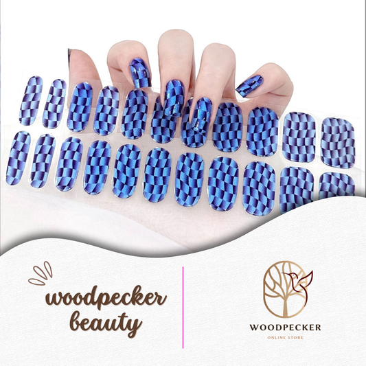 Blue and purple 3D optical illusion nail wraps with a geometric cube pattern
