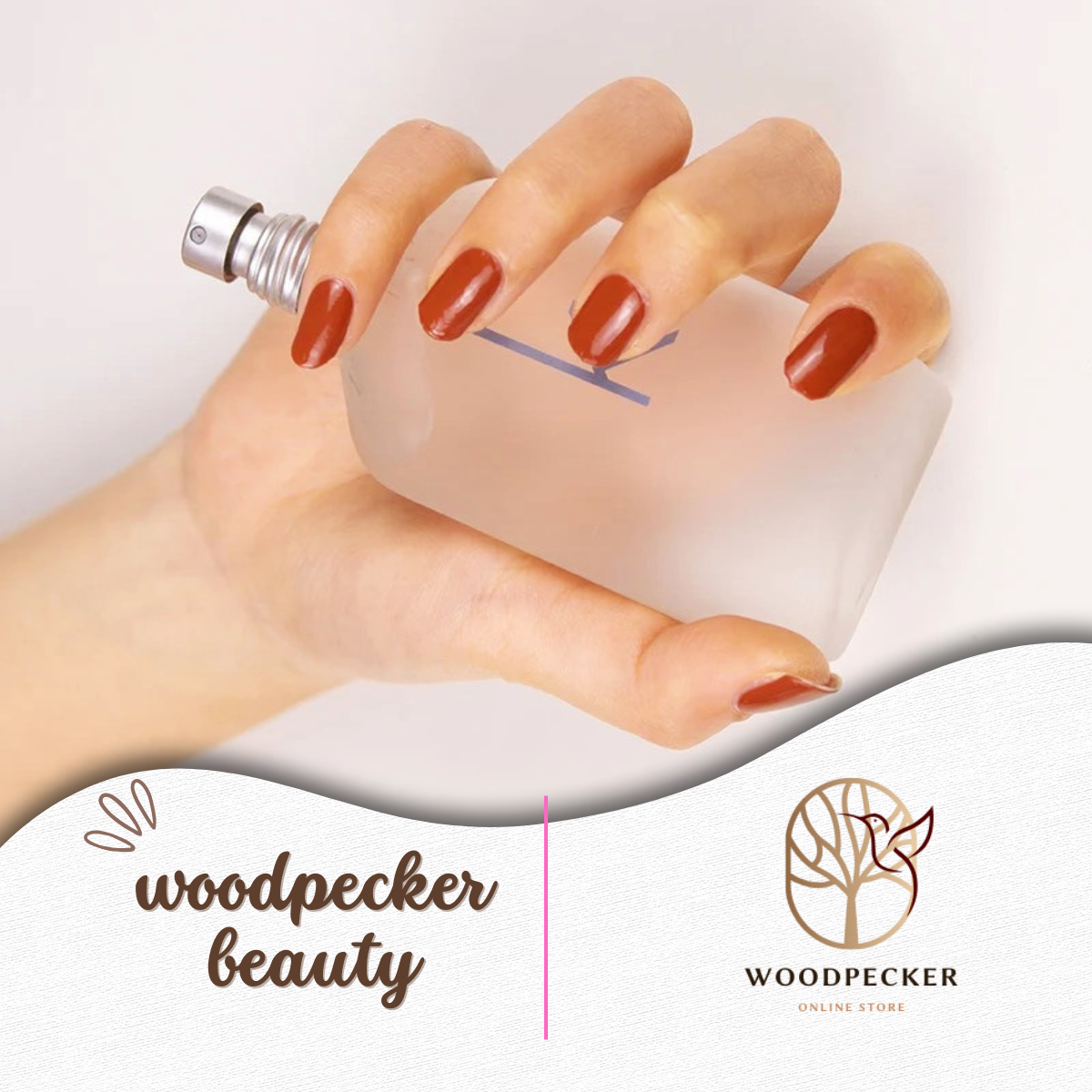 Hand with soft caramel nude nail wraps holding a perfume bottle.
