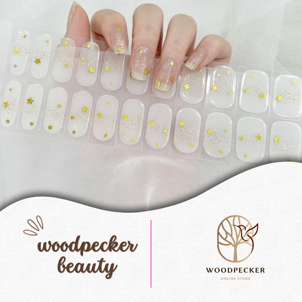 Transparent nail stickers with scattered gold star glitter for a delicate and airy design.
