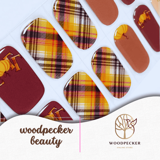 Autumn-themed nail stickers with plaid prints, pumpkins, and warm brown tones.
