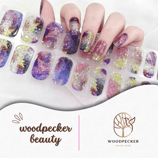 Colorful galaxy-inspired nail stickers with chunky glitter, rainbow gradients, and shimmering effects.

