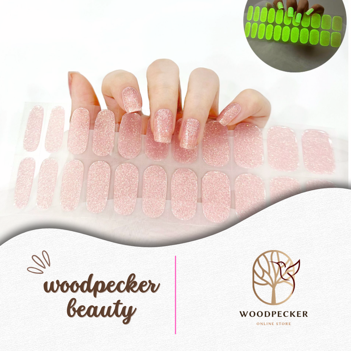 Hand with pink glitter nail stickers that glow green in the dark
