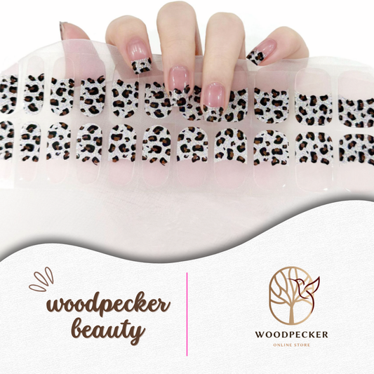Leopard print French tip nail stickers with white glitter base – bold animal design by Woodpecker Beauty

