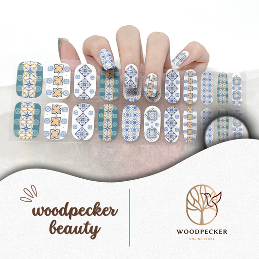 Blue and terracotta Medina tile pattern semi-cured gel nail stickers on hand
