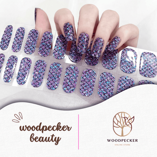 Purple and blue holographic nail stickers with a mermaid scale pattern and glitter finish.
