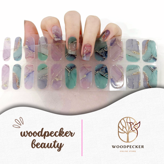 Purple and green marble nail wraps with gold lines by Woodpecker Beauty
