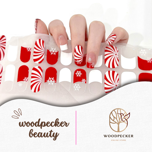 Red and white Christmas semi-cured gel nail wraps with peppermint swirls and snowflake patterns
