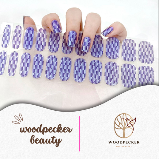 Hand with purple 3D checkerboard pattern semi-cured gel nail wraps, UV lamp required
