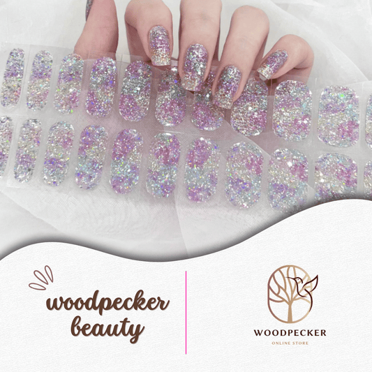 Full-cover nail stickers with iridescent rainbow glitter in pink, blue, gold, and purple for a bold sparkling effect.
