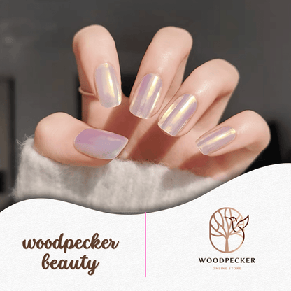 Iridescent pearl nail stickers with a soft purple and gold sheen.
