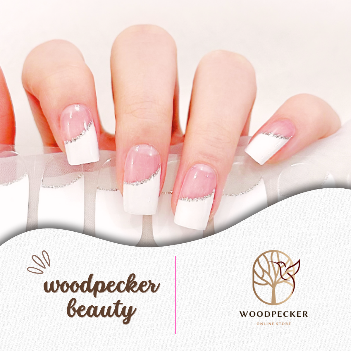 Elegant white French tip nail stickers with a diagonal silver glitter line on a clear pink base.
