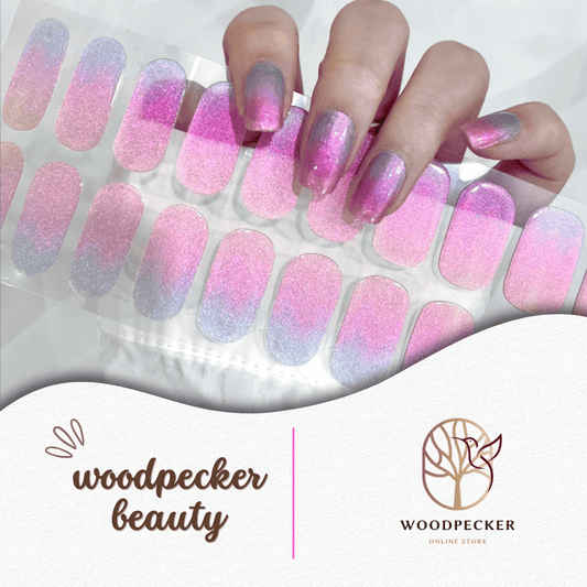 Gradient nail stickers in pink, purple, and blue with subtle shimmer and a soft ombre effect.
