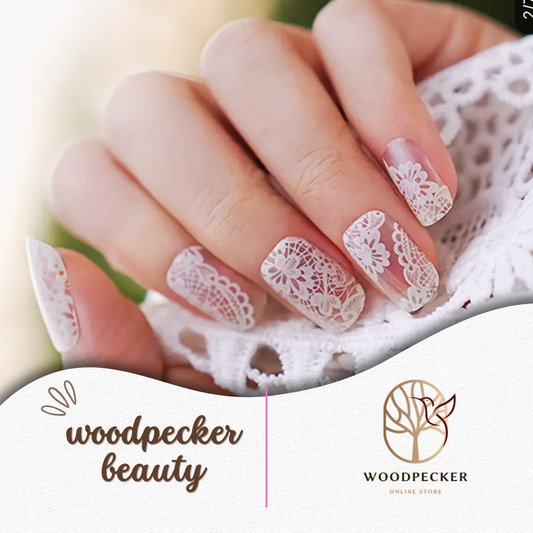 Hand with semi-cured gel nail wraps featuring delicate white lace pattern, UV lamp required